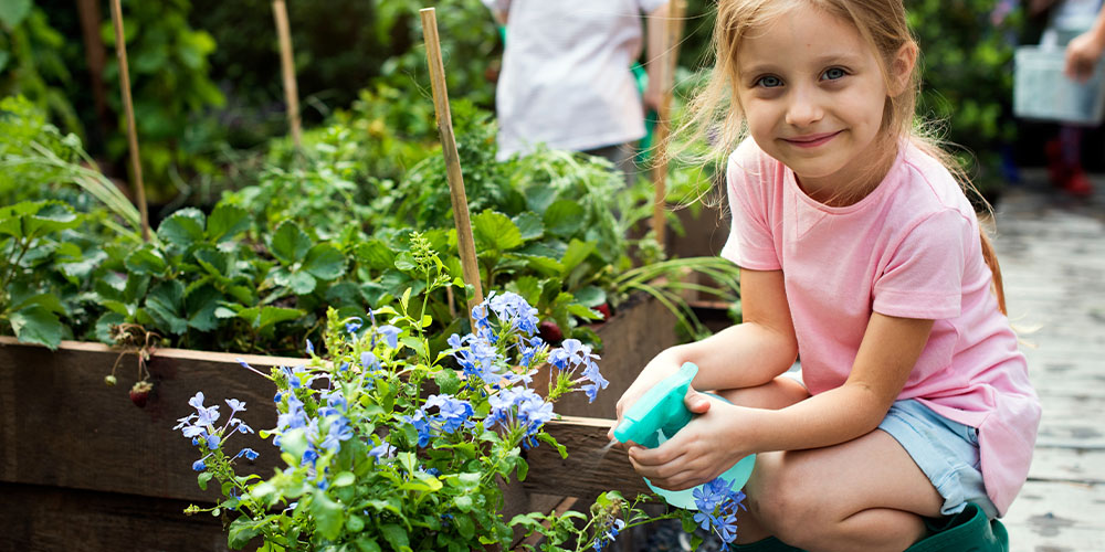 Pine Hills Nursery-Mississippi- How to Design a Kid Friendly Garden-child in garden